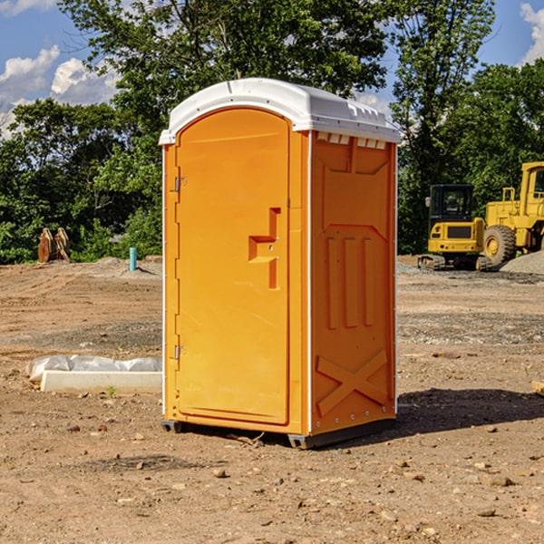 what is the cost difference between standard and deluxe portable toilet rentals in Falls City